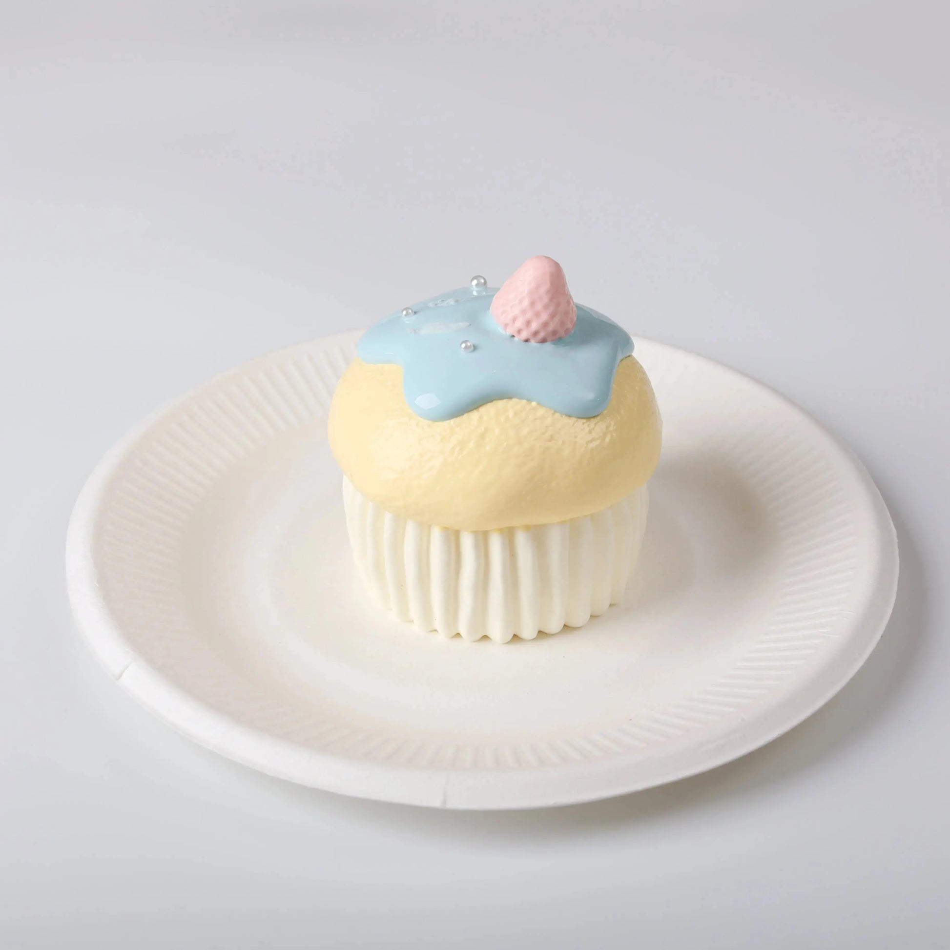 Side view of Creamy Tree Blue Cupcake Squishy Toy