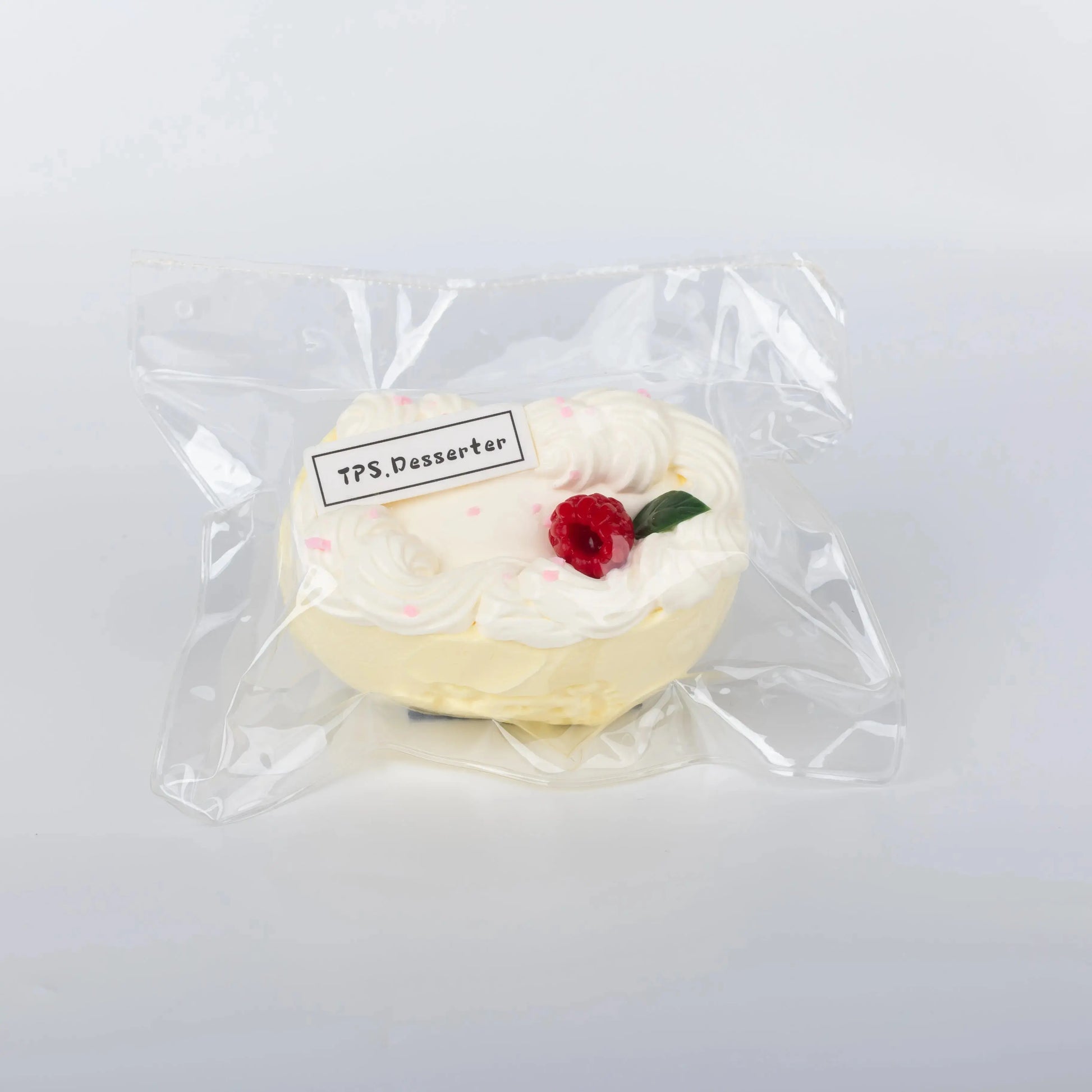 Side view of Berry Cream Roll food squishy toy