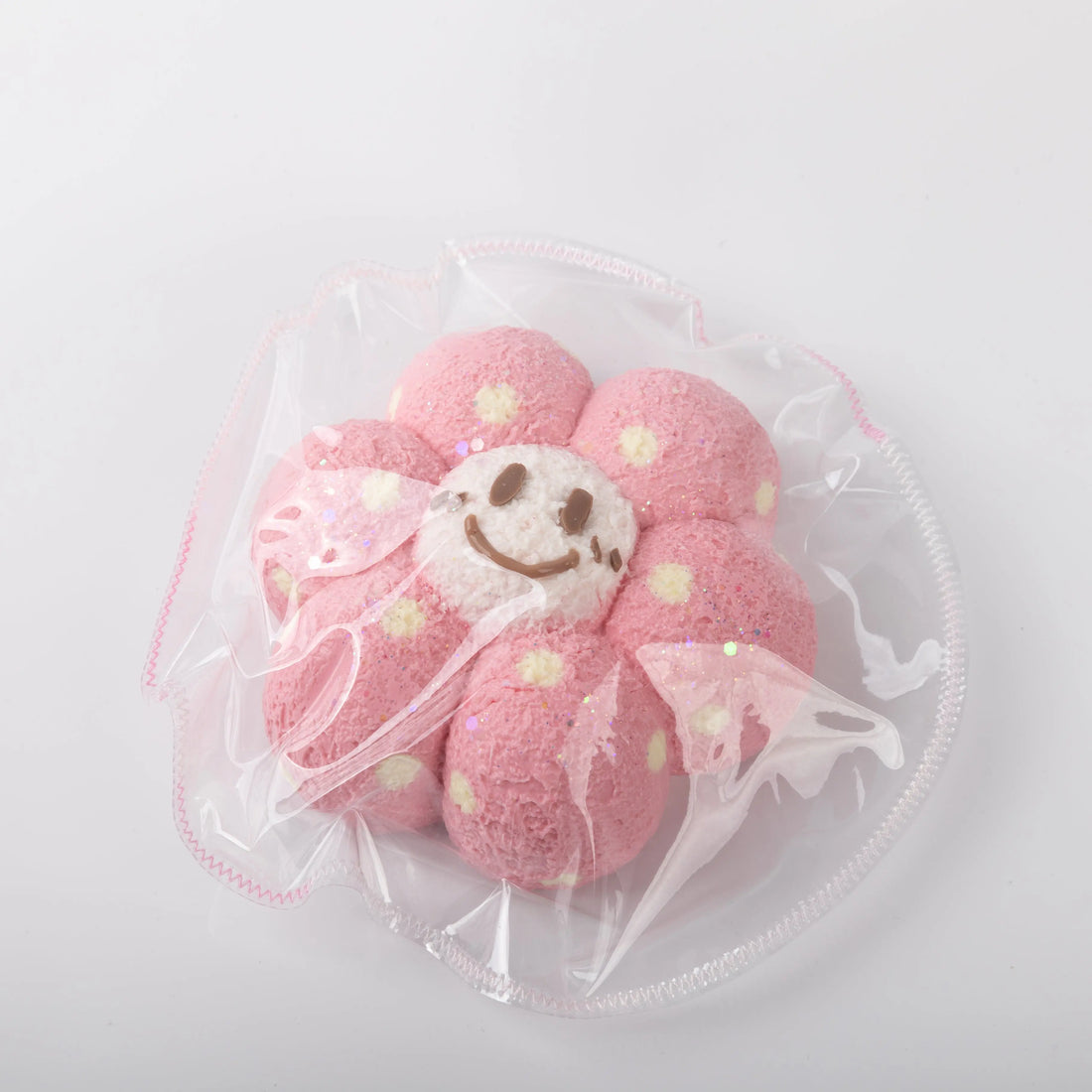 Front view of Creamy Tree Pink Sunny Flower Squishy toy with cute smiling