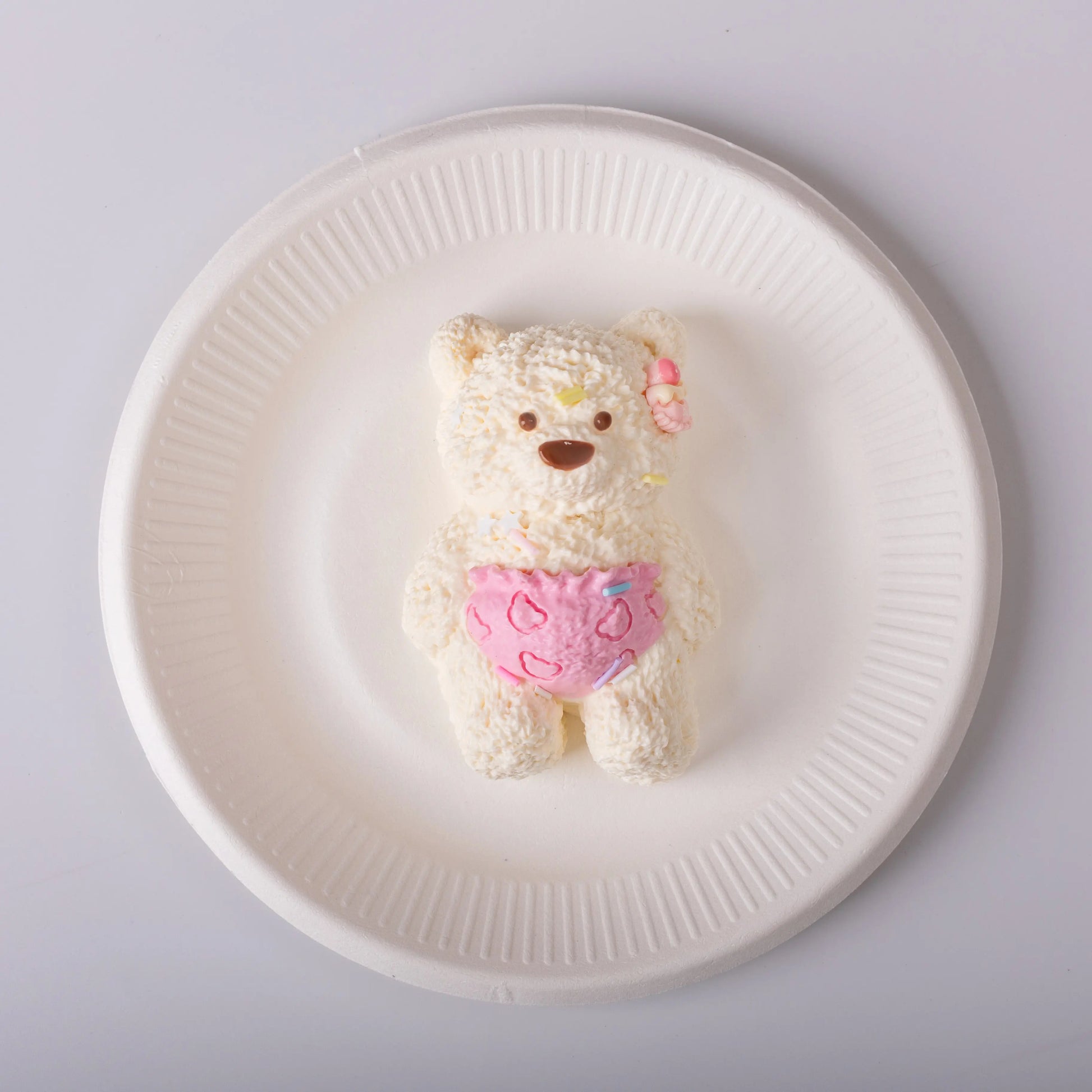 Lily bear in a white plate
