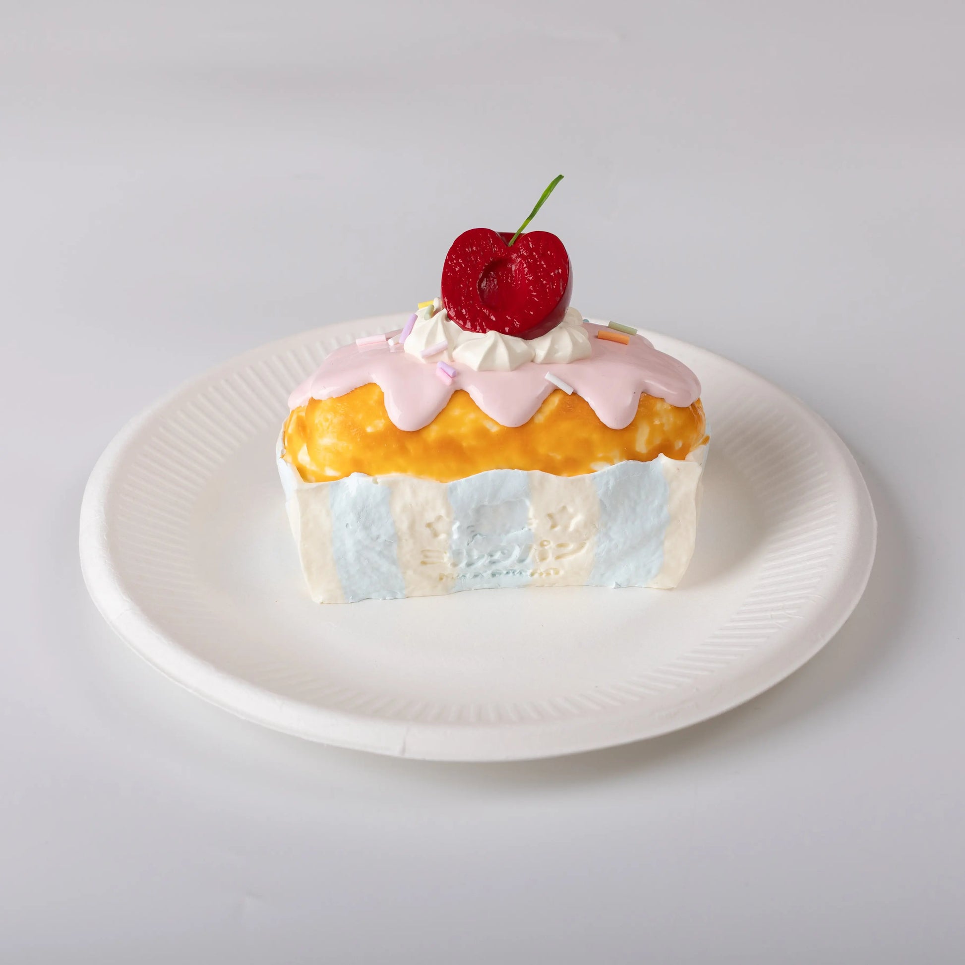 Front view of Creamy Tree Cherry Bar Cake Squishy Toy