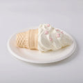 Creamy Tree Vanilla Ice Cream Cone Squishy Toy in a white plate