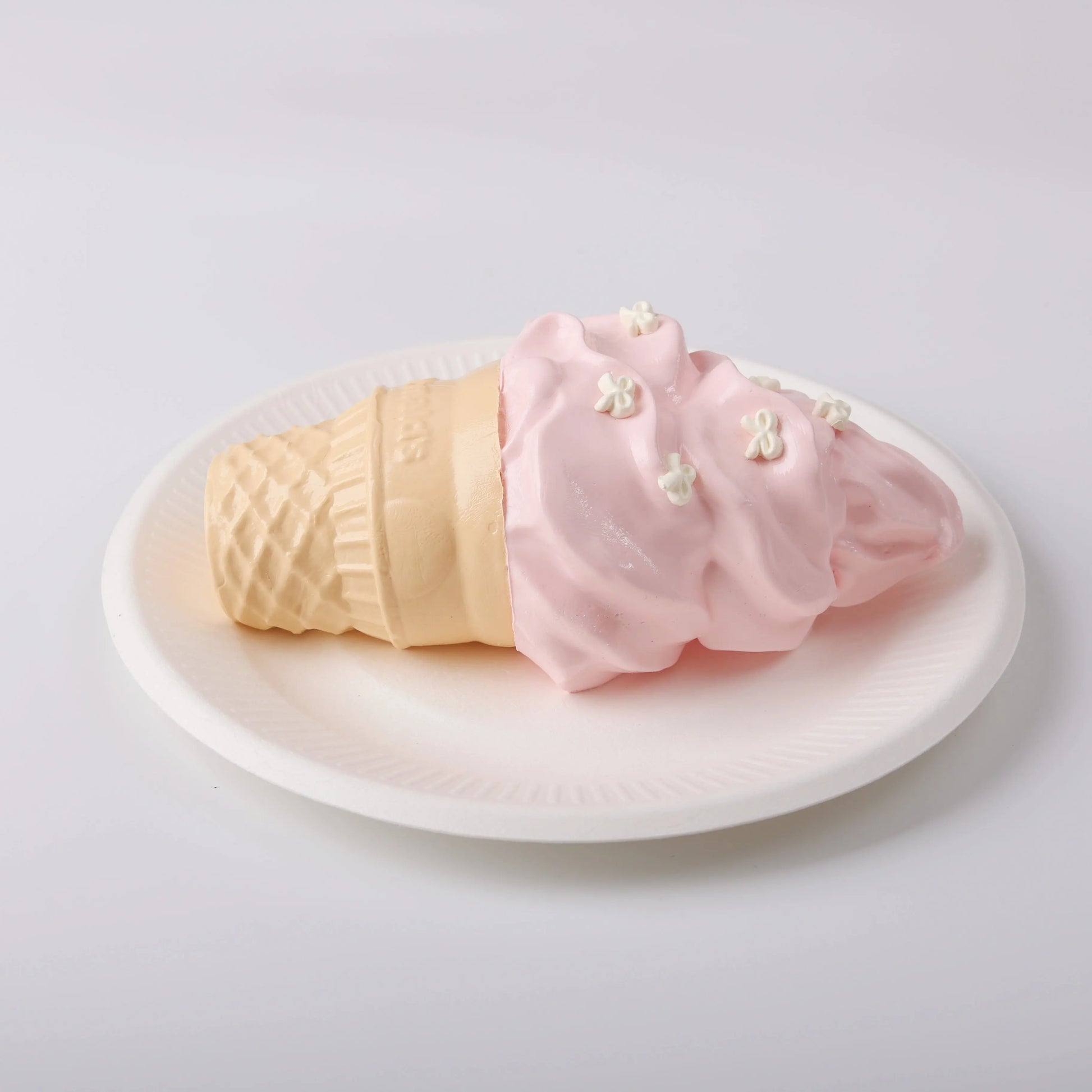 Creamy Tree Strawberry Ice Cream Cone Squishy Toy in a white plate