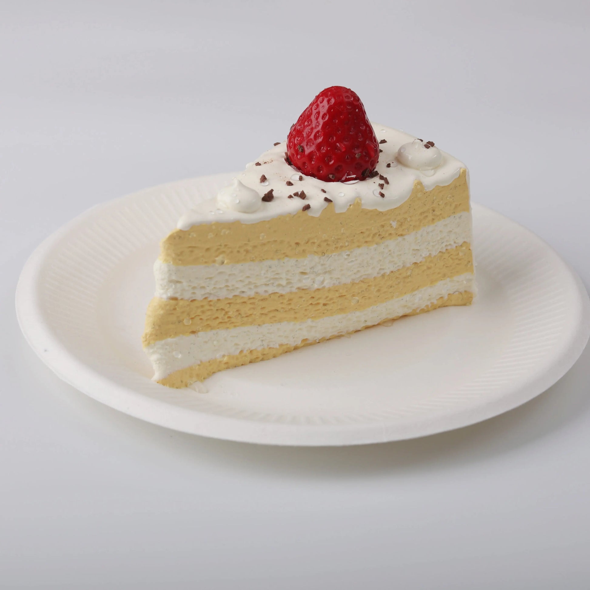 Side view of Creamy Tree Strawberry Chocolate Crumble Cake Squishy Toy