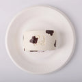 Creamy Tree Cow Swiss Roll Squishy Toy in a white plate