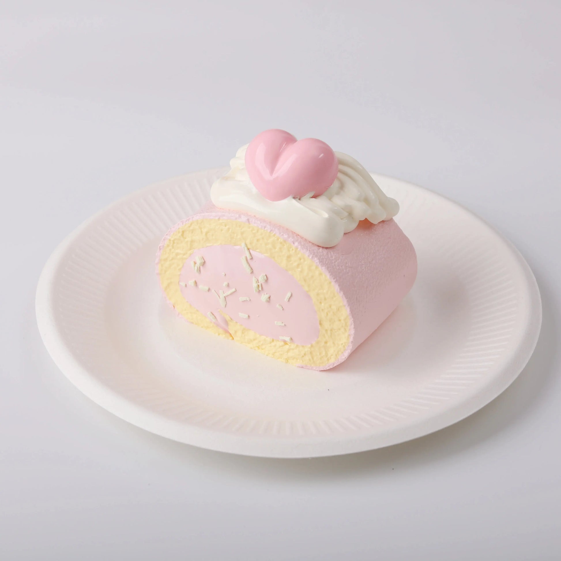 Creamy Tree Heart Angel Roll Squishy Toy in a white plate