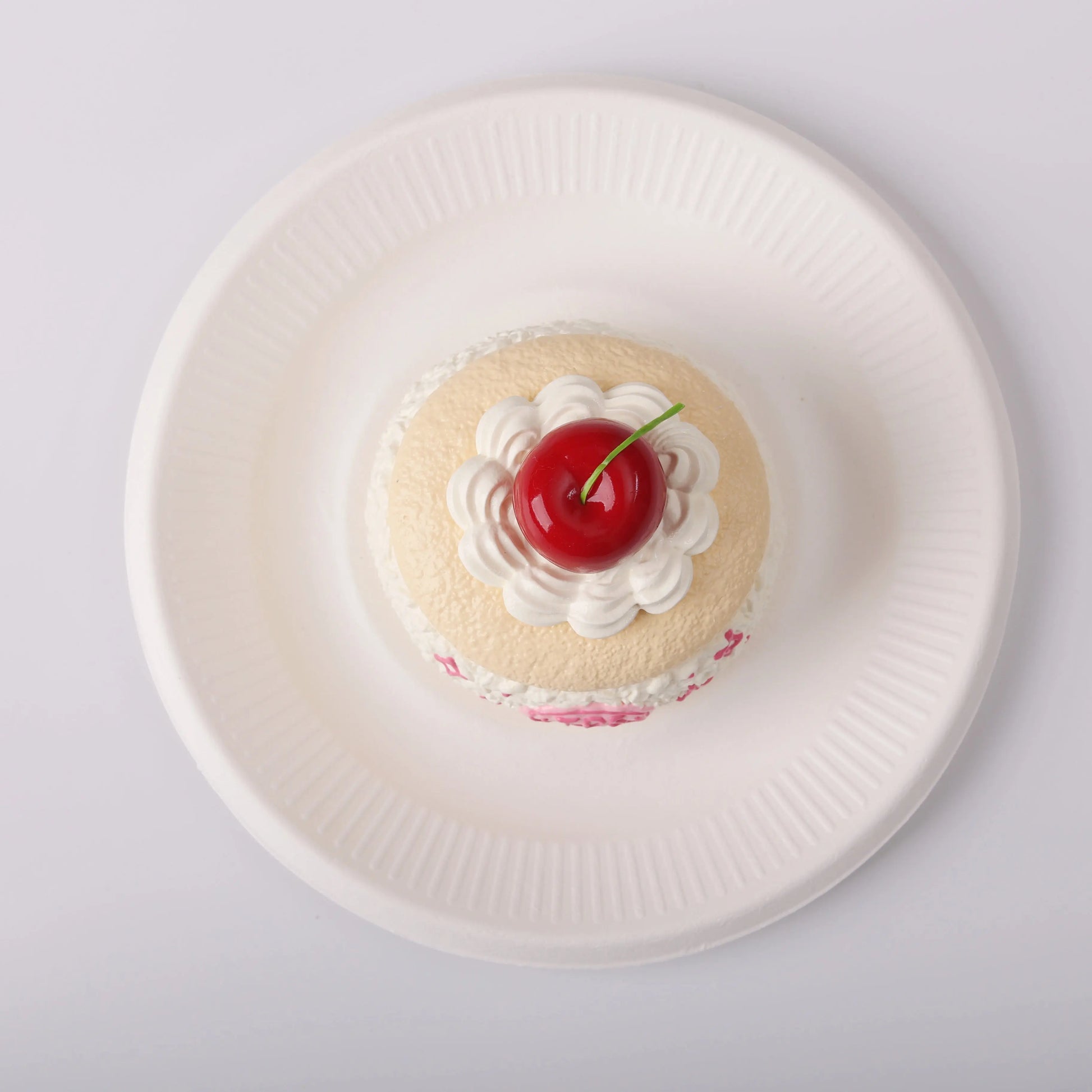 top view of Creamy Tree Cherry Macaron Cake Squishy Toy