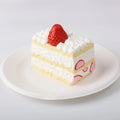 Strawberry Filled Cake Squishy Toy in a white plate