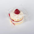 Side view of Strawberry Ribbon Cake food squishy toy