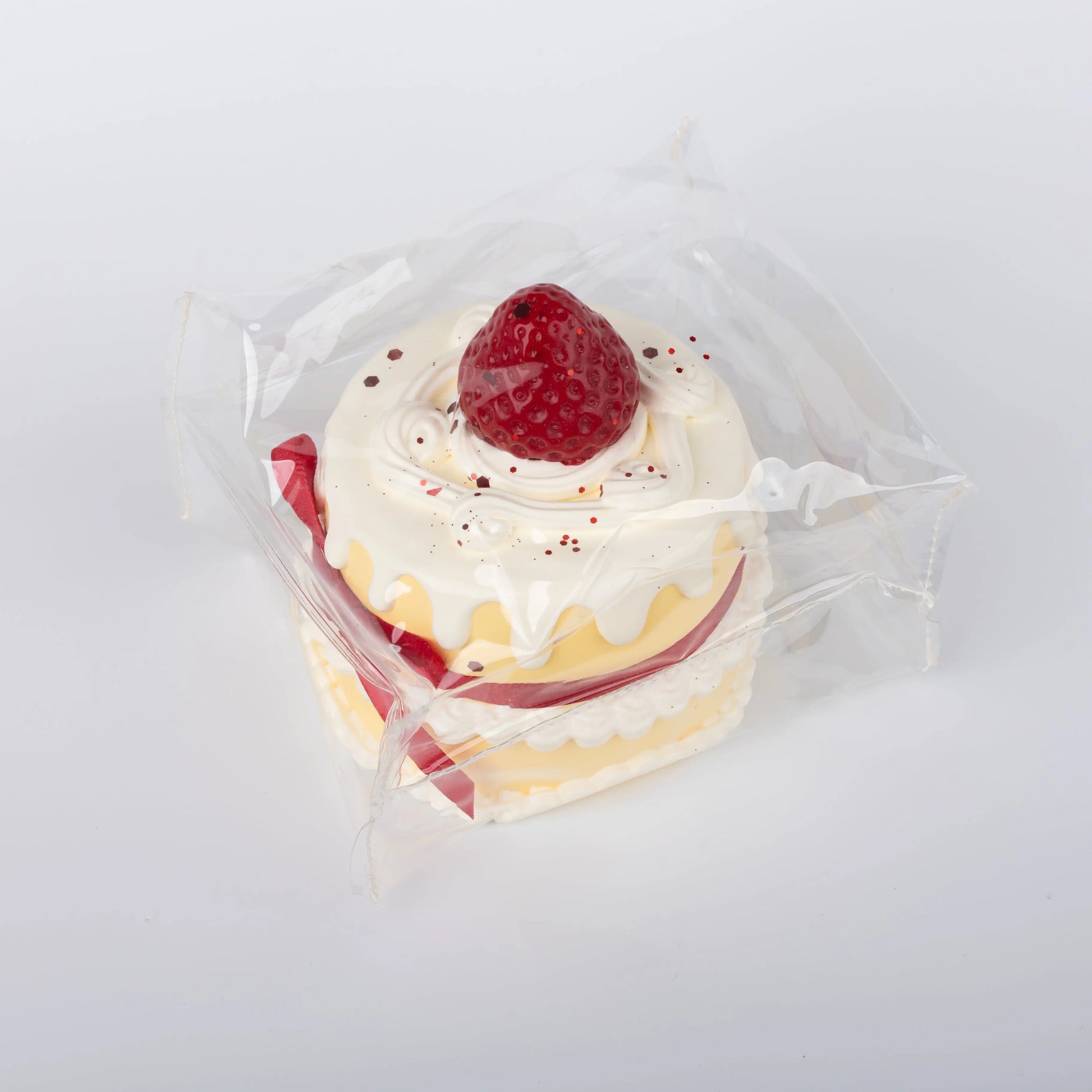 Side view of Strawberry Ribbon Cake food squishy toy