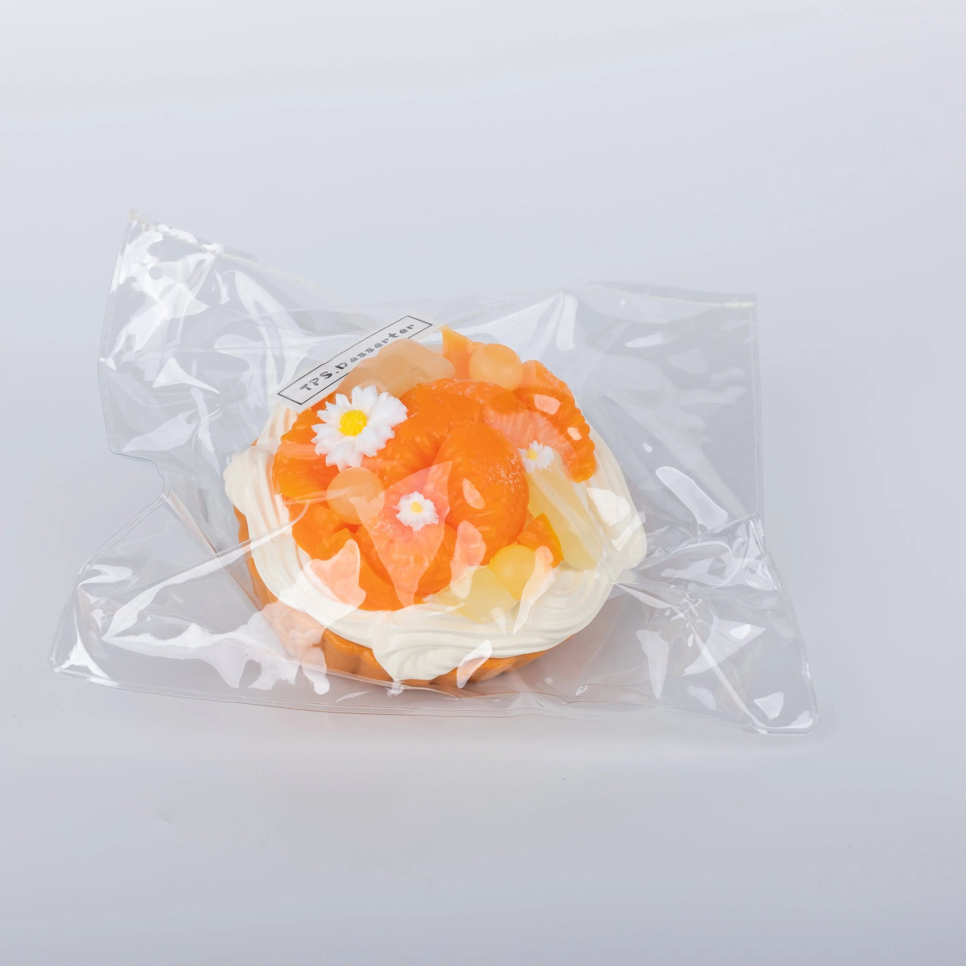 Side view of Orange Tart food squishy toy