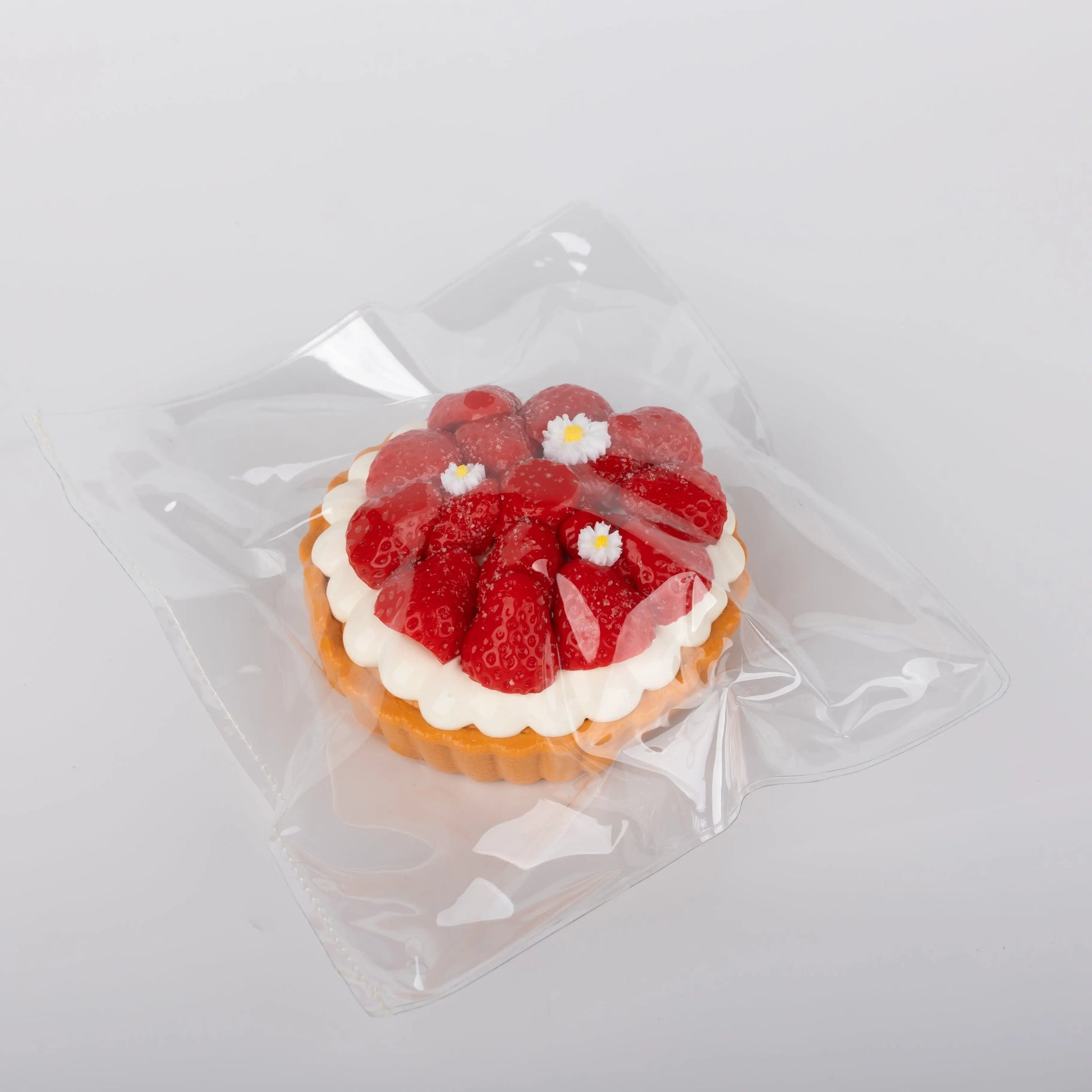 Side view of Sweet Strawberry Tart  food squishy toy