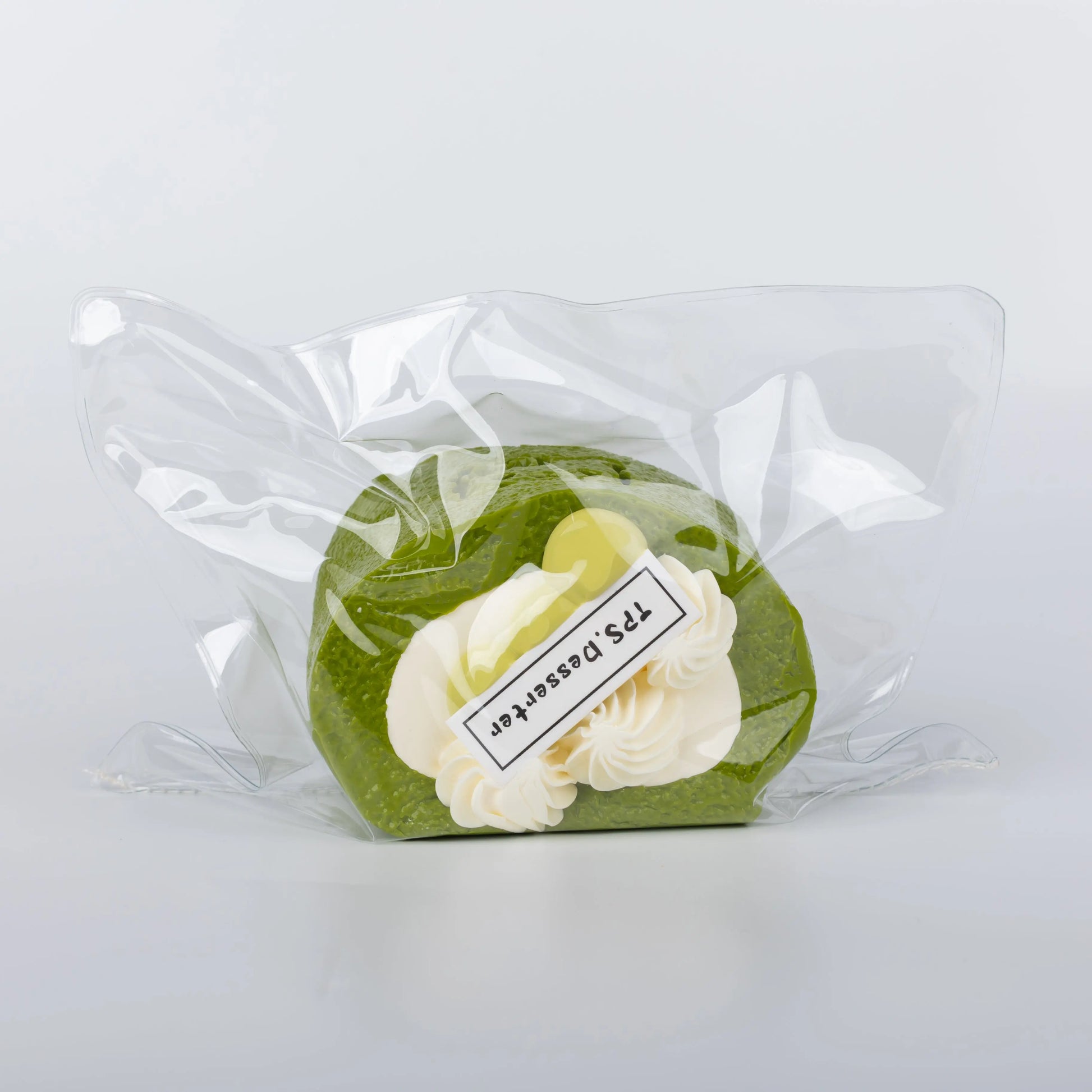 Side view of Matcha Cream Roll food squishy toy
