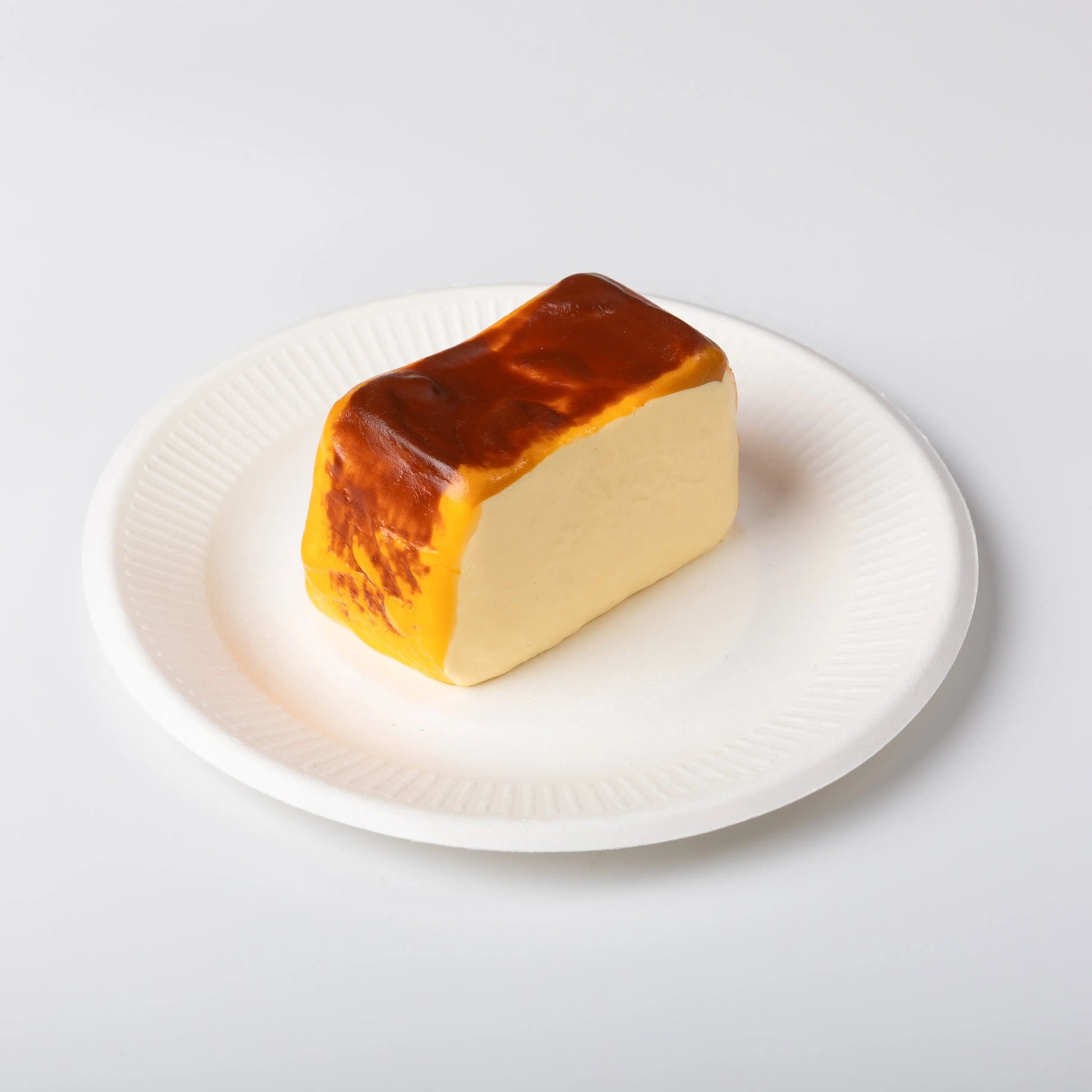 Side view of Creamy Tree Basque Cheesecake Squishy Toy