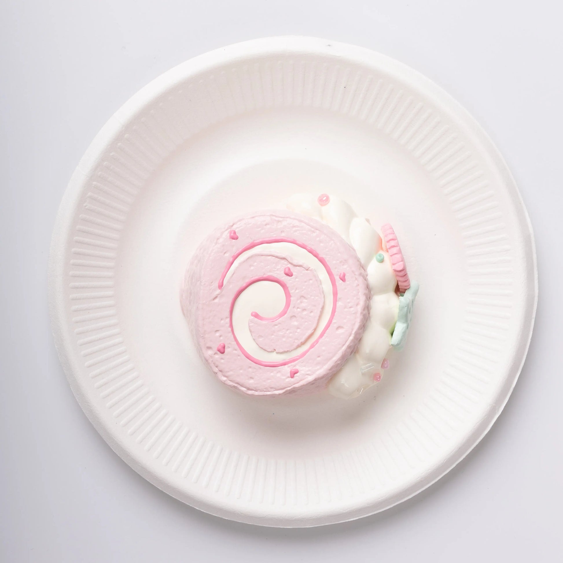 Top view of Creamy Tree Pink Heart Swiss Roll Squishy Toy