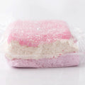Front view of Creamy Tree Glitter Pink Squishy Bread toy with three different layers