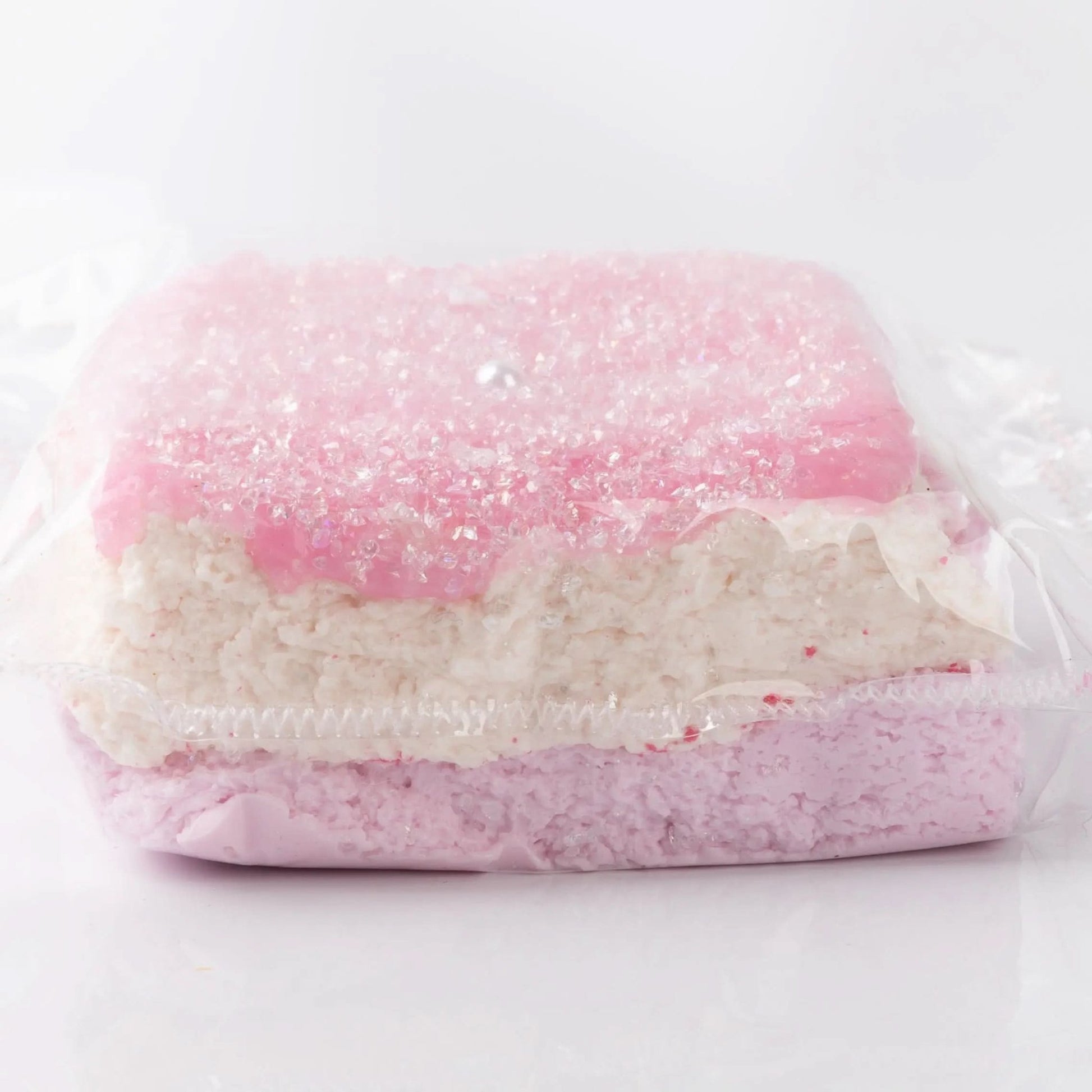 Front view of Creamy Tree Glitter Pink Squishy Bread toy with three different layers