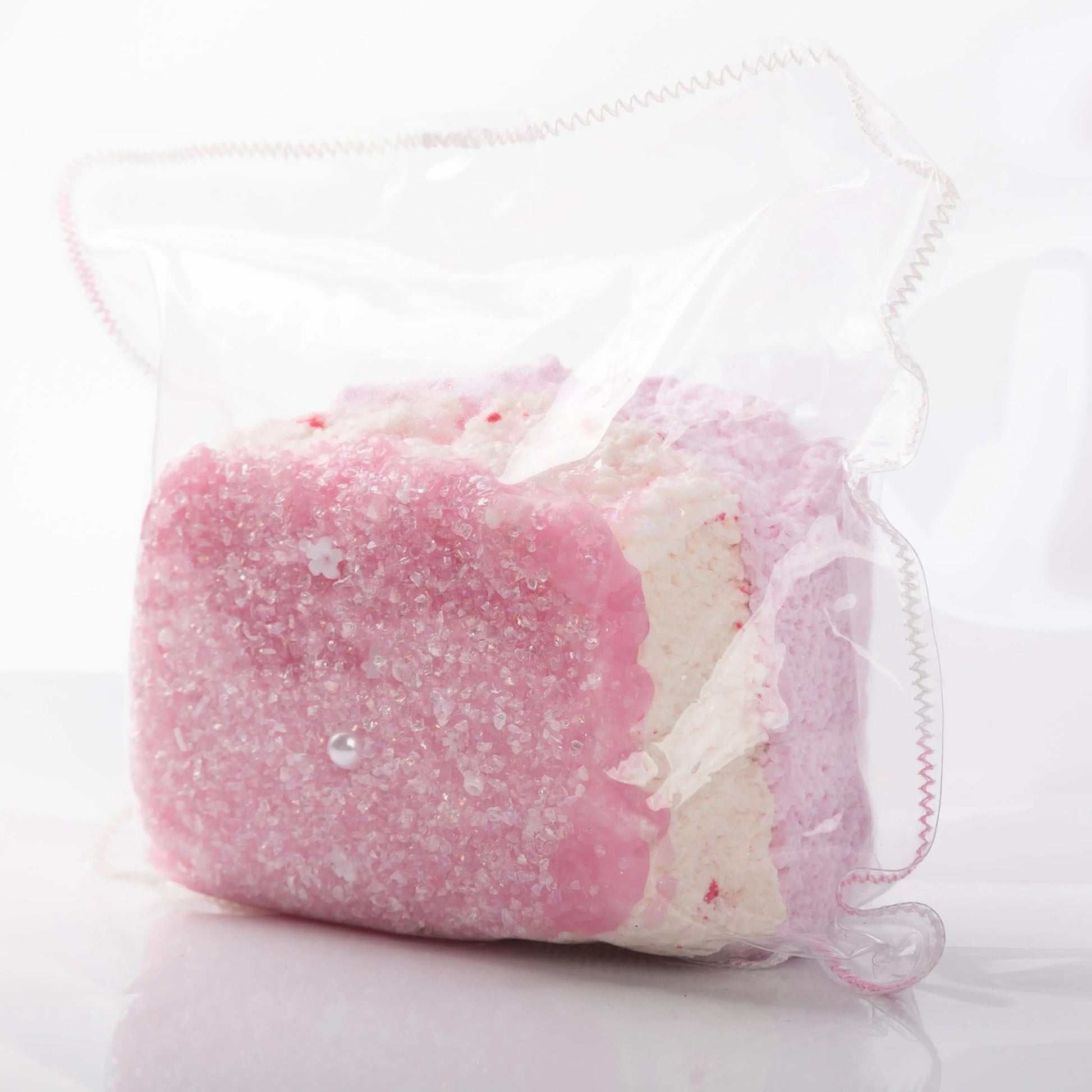 Side view of Creamy Tree Shining Pink Bread Squishy toy with three different layers