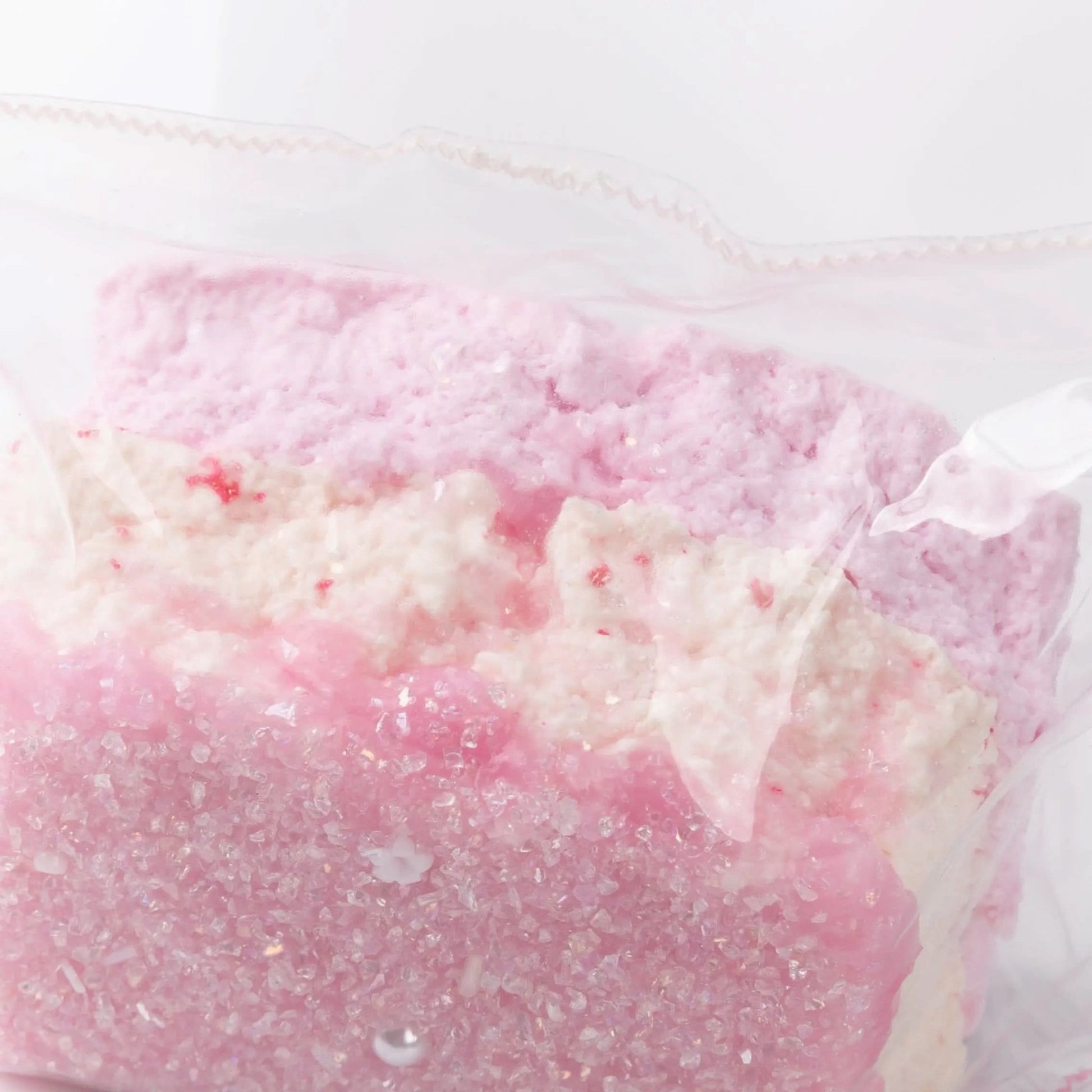 Close-up of Creamy Tree Pink, white and purple Shining Squishy Bread toy 