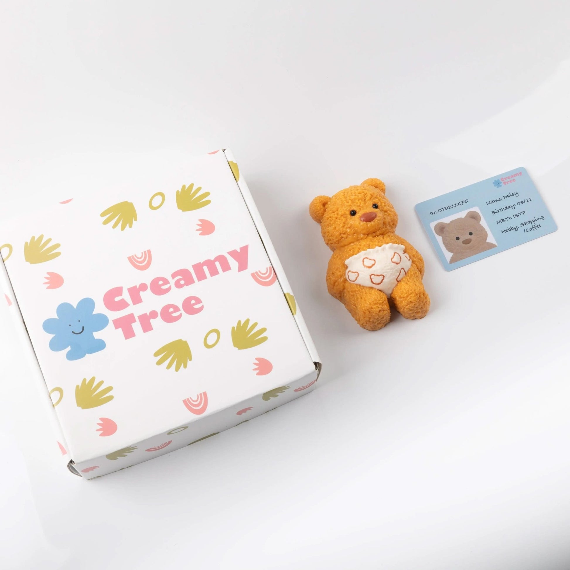Creamy Tree stress toy bear with packaging box and character ID card on white background