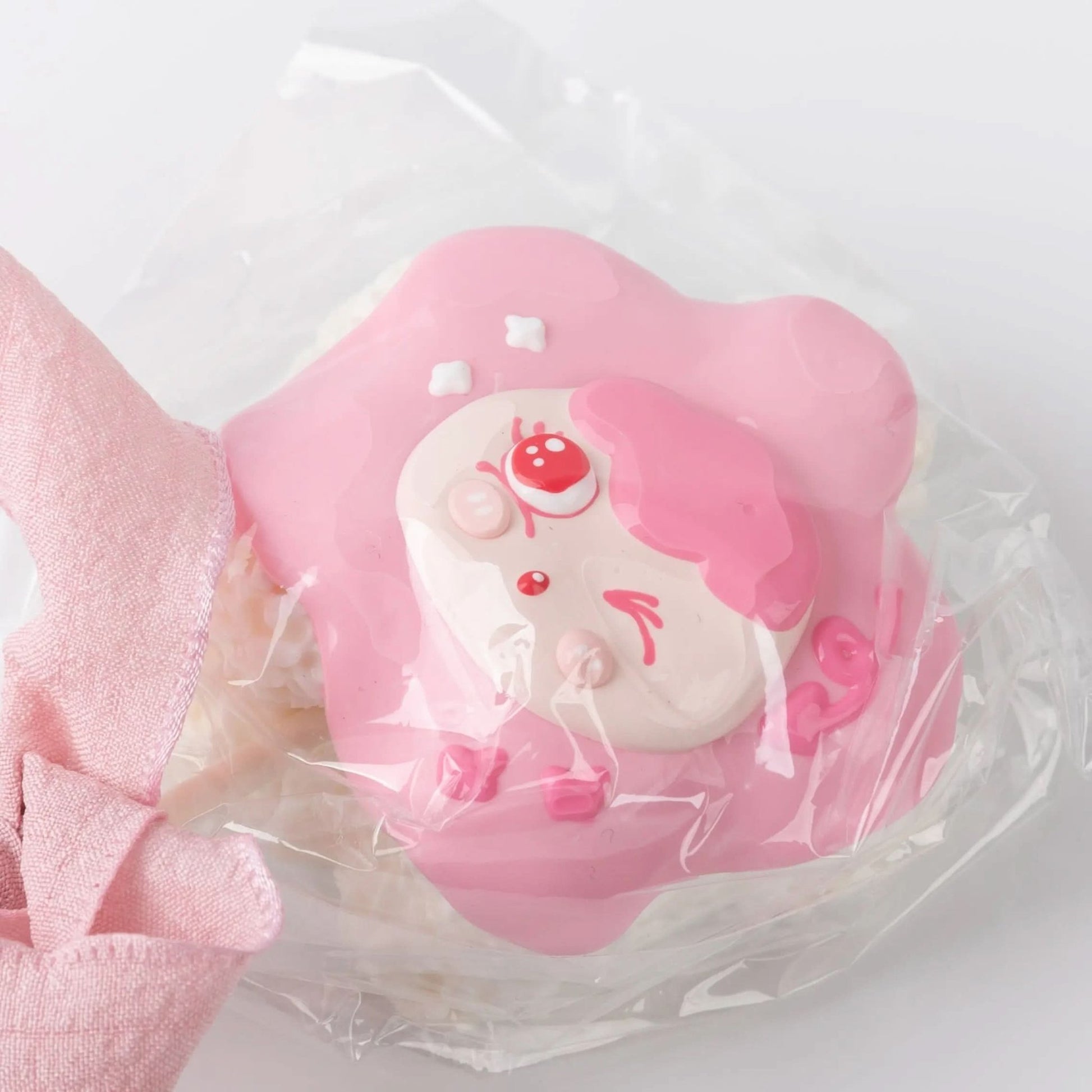 Close-up of Pink Lollipop Squishy toy with an adorable girl face