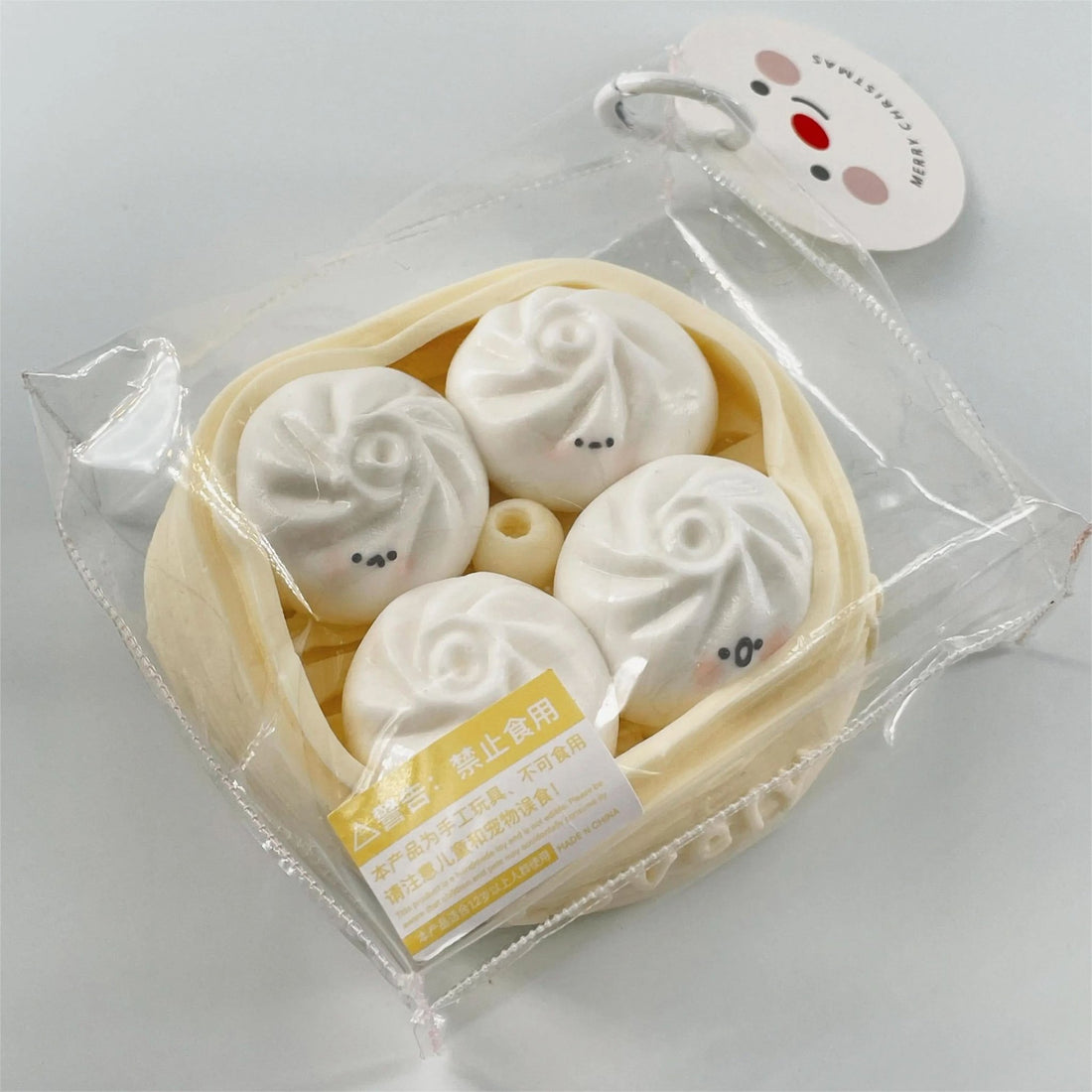 Front view of Creamy Tree Pink Dumplings Squishy toy with cute emotions